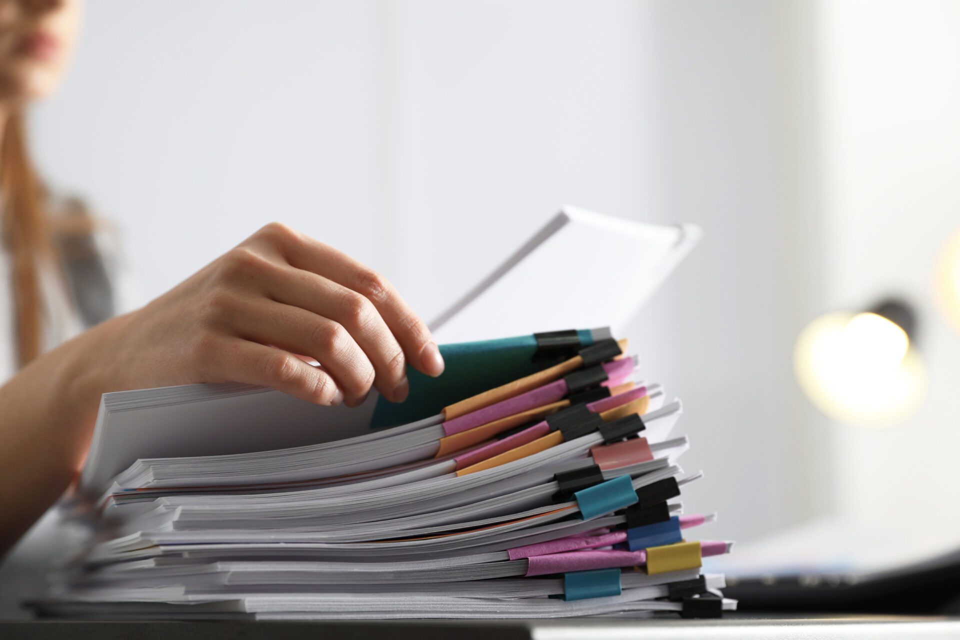 Office employee working with documents at table, closeup