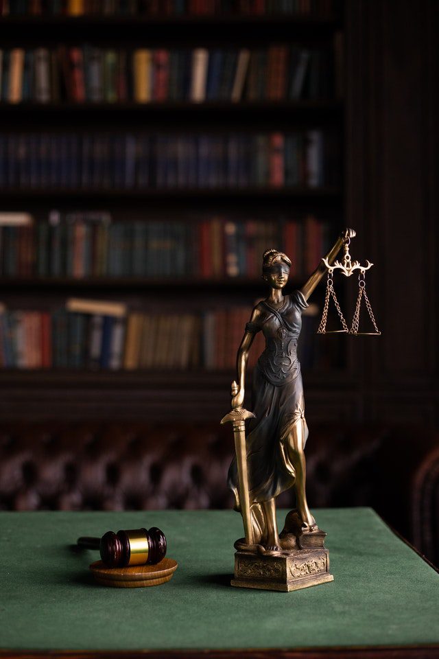 Judges desk with gavel and scales